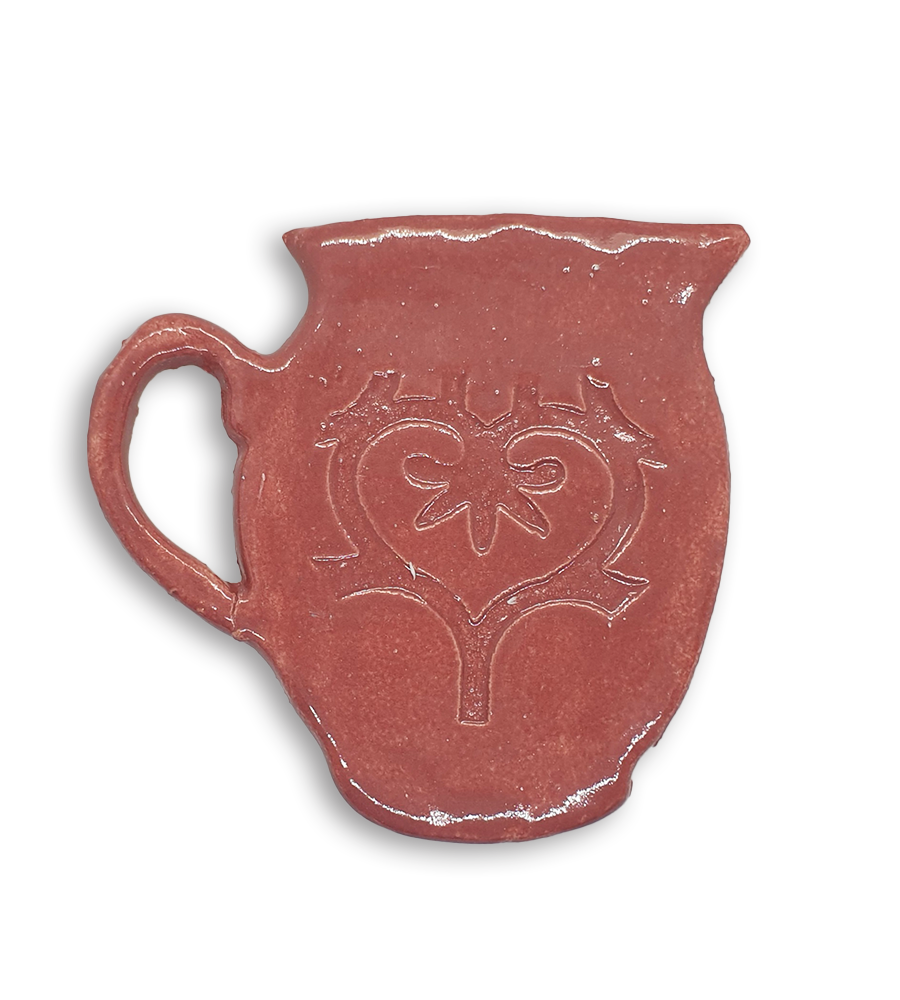 A hand-painted pink jug ceramic mosaic insert with a swirling heart design.
