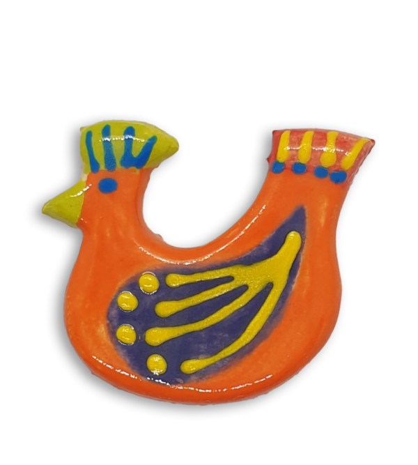 A hand-painted bright orange hen ceramic mosaic insert with purple wings.