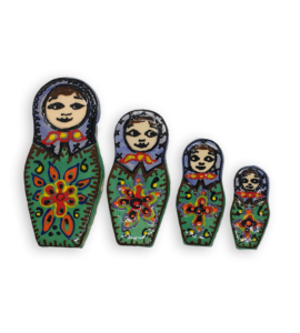 A set of four hand-painted Russian Doll ceramic mosaic inserts with green dresses and purple headscarves, and brown edging.