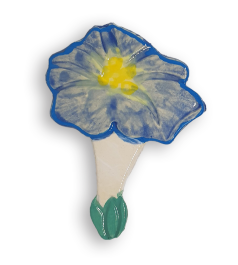 A ceramic mosaic insert in the shape of a pale blue Morning Glory flower.