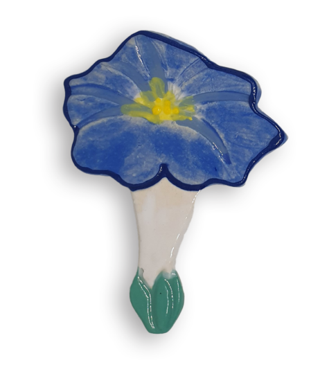 A ceramic mosaic insert in the shape of a deep blue Morning Glory flower.