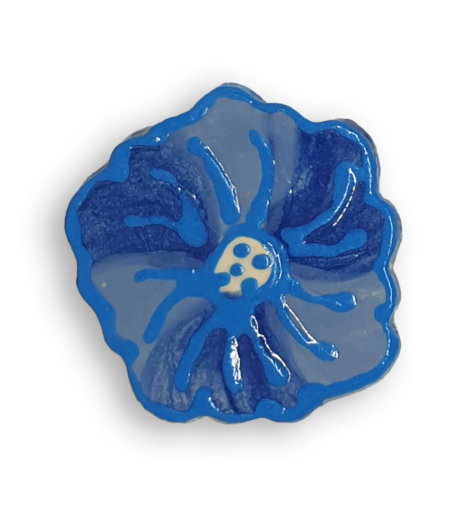 A ceramic mosaic insert in the shape of a light blue poppy flower.