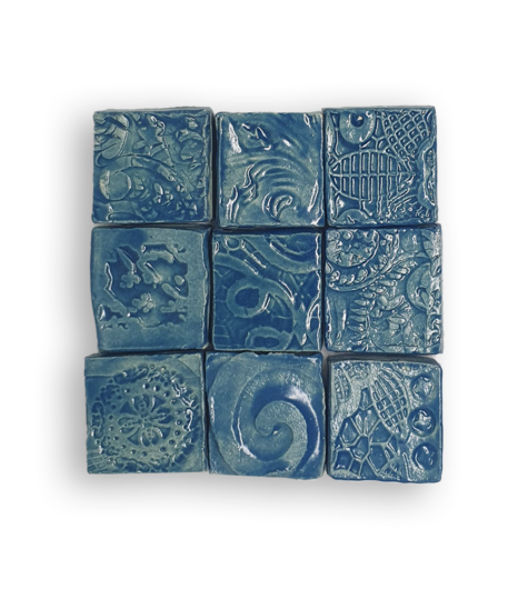 A collection of nine textured square tiles in teal.