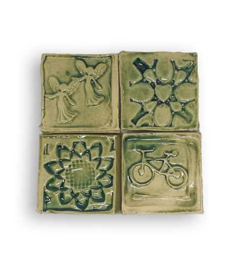 A collection of four textured square tiles in olive green.