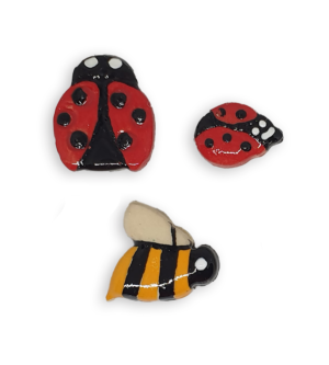 A selection of ceramic mosaic inserts in the shapes of ladybugs and bees.