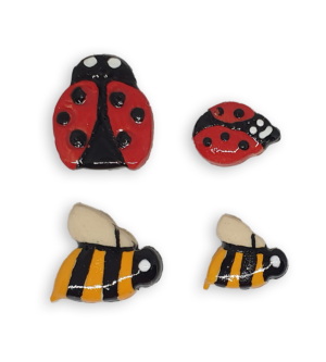 A selection of ceramic mosaic inserts in the shapes of ladybugs and bees.