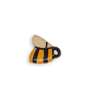 A ceramic mosaic insert in the shape of a small bee.